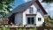 The picture shows a detached house with a Viessmann solar thermal system